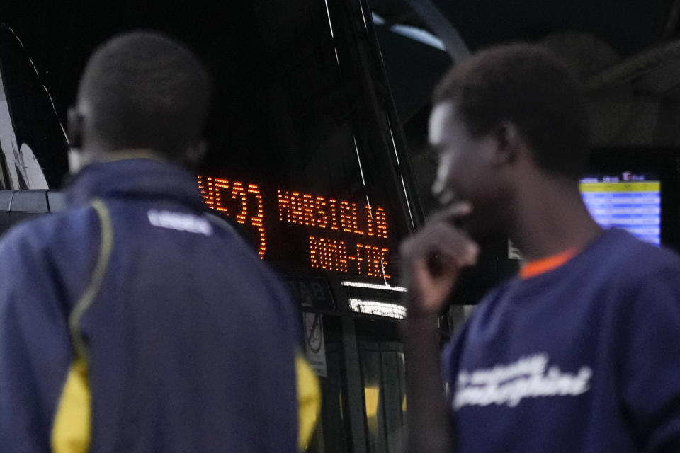 Migrants wait to board a bus directed to Marseille, France, in Rome, Tuesday, Sept. 12, 2023. Ten years after Pope Francis made a landmark visit to the Italian island of Lampedusa to show solidarity with migrants, he is joining Catholic bishops from around the Mediterranean this weekend in France to make the call more united, precisely at the moment that European leaders are again scrambling to stem the tide of would-be refugees setting off from Africa. (AP Photo/Gregorio Borgia)
