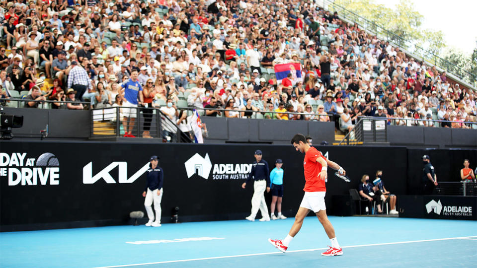 Novak Djokovic (pictured) warming up in front of a full crowd ahead of an exhibition match in Adelaide.