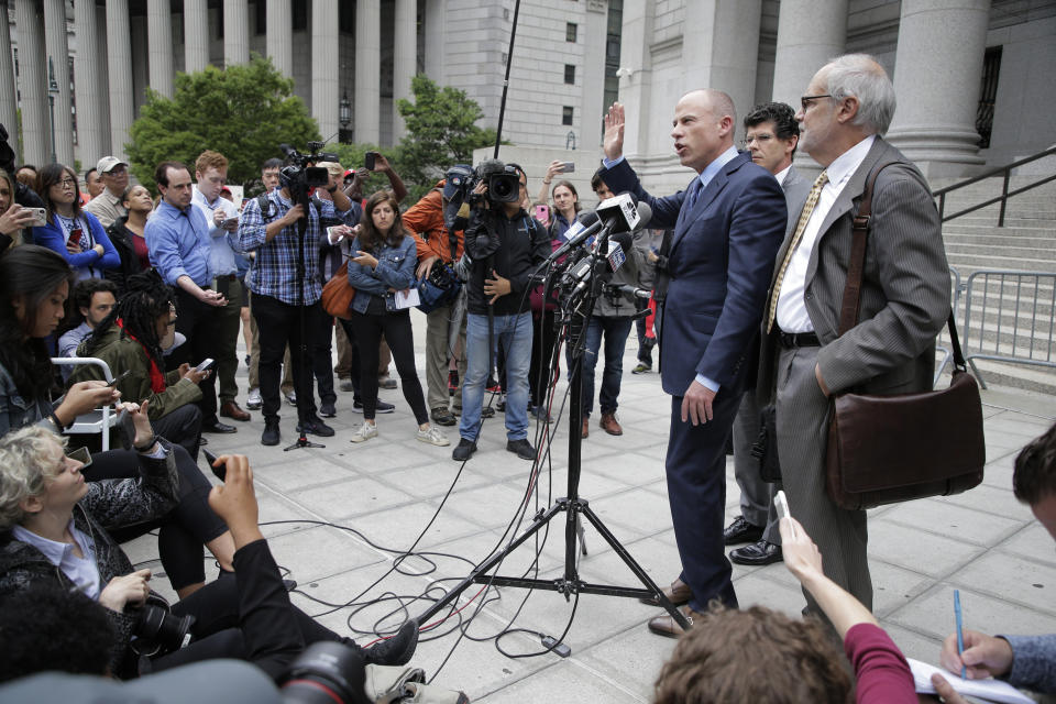 Michael Avenatti, center right, speaks to reporters after leaving a courthouse in New York, Tuesday, May 28, 2019. (AP Photo/Seth Wenig)