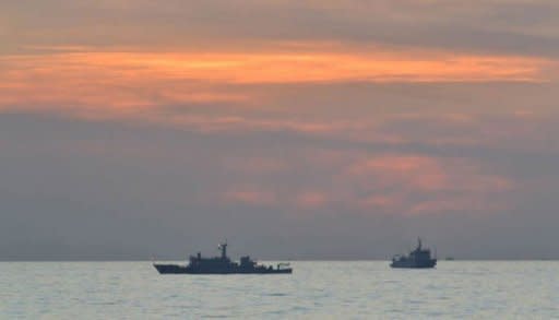 A Philippine navy photo shows Chinese surveillance ships off Scarborough Shoal, on April 11. The Philippines said it remained locked in a stalemate with China over a disputed shoal in the South China Sea