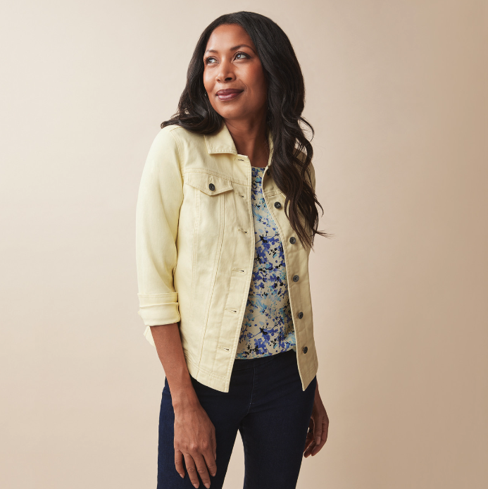 woman wears Northern Reflections yellow Microsand Jean Jacket