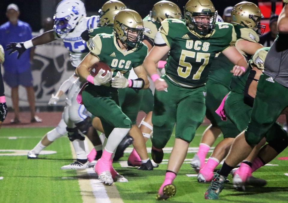 Ouachita Christian's Zach White (11) carries the ball.