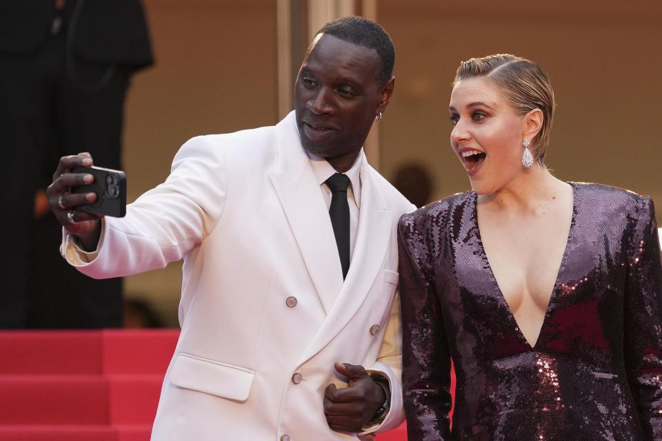 Jury member Omar Sy, left, and jury president Greta Gerwig pose for photographers upon arrival at the awards ceremony and the premiere of the film 'The Second Act' during the 77th international film festival, Cannes, southern France, Tuesday, May 14, 2024. (Photo by Scott Garfitt/Invision/AP)