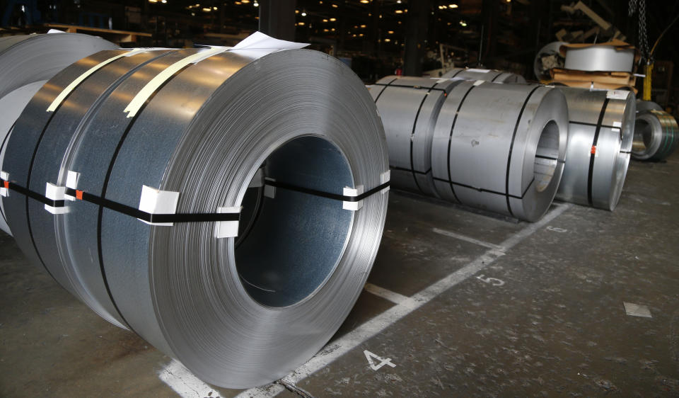 FILE - In this July 11, 2018, file photo rolls of steel sit in a warehouse at a fabrication company in Chester, Va. The 25% tariffs President Donald Trump has imposed on thousands of Chinese-made products have business owners trying to determine how or whether they can limit the damage to profits from the import duties. (AP Photo/Steve Helber, File)