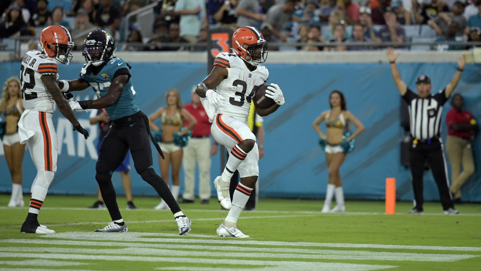 Cleveland Browns running back Jerome Ford (34) scores a touchdown against the Jacksonville Jaguars during the first half of an NFL preseason football game, Friday, Aug. 12, 2022, in Jacksonville, Fla. (AP Photo/Phelan M. Ebenhack)