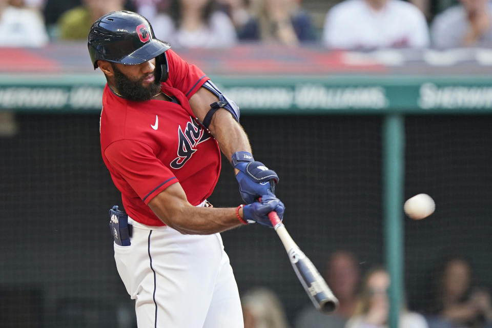 Cleveland Indians' Amed Rosario hits a one-run double in the sixth inning of a baseball game against the Kansas City Royals, Saturday, July 10, 2021, in Cleveland. (AP Photo/Tony Dejak)