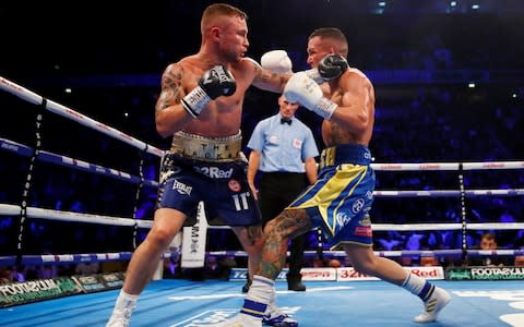 Josh Warrington in action against Carl Frampton - Credit: Action Images