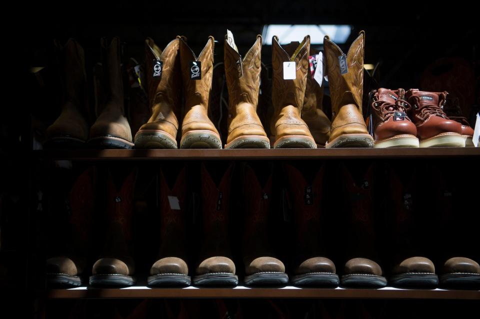 Sunlight shines on rows of boots at Boot Barn, located at 112 Walker Springs Road in West Knoxville, Friday, May 21, 2021. Boot Barn, which operates over 250 locations in 30 states, opened its newest Knoxville location in March. 