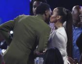 Rece Mitchell, right, congratulates NBA player Lou Williams, of the Los Angeles Clippers, before he walks on stage to accept the NBA sixth man award at the NBA Awards on Monday, June 24, 2019, at the Barker Hangar in Santa Monica, Calif. (Photo by Richard Shotwell/Invision/AP)