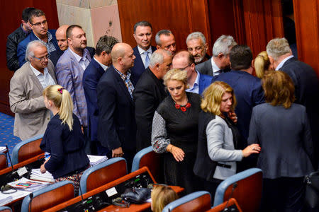 A group of opposition members of the VMRO-DPMNE stand to boycott the vote as the Macedonian parliament passed constitutional changes to allow the Balkan country to change its name to the Republic of North Macedonia, in Skopje, Macedonia, October 19, 2018. REUTERS/ Tomislav Georgiev