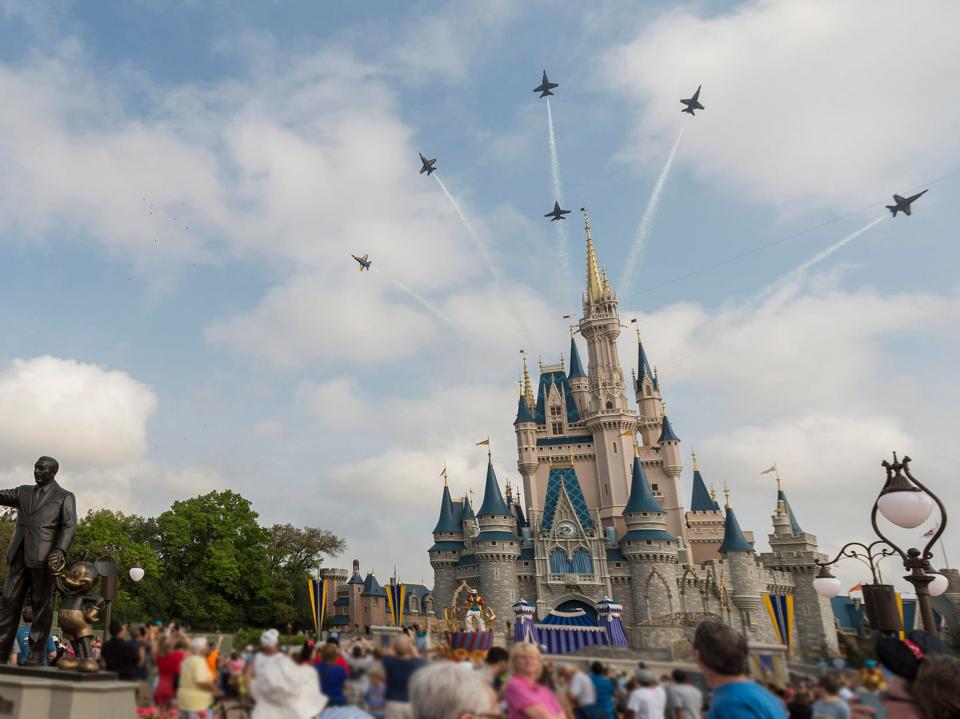 U.S. Navy Blue Angels Soar Above Cinderella Castle At Walt Disney World Resort