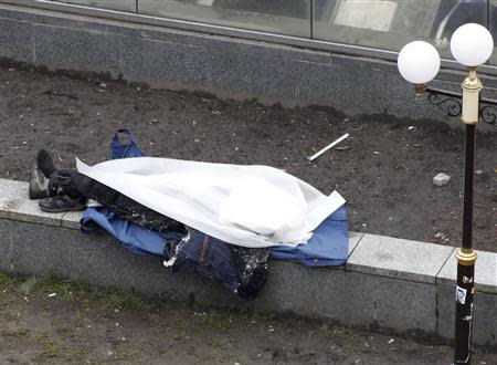 A view of a dead body in Independence Square in Kiev February 20, 2014. REUTERS/Vasily Fedosenko