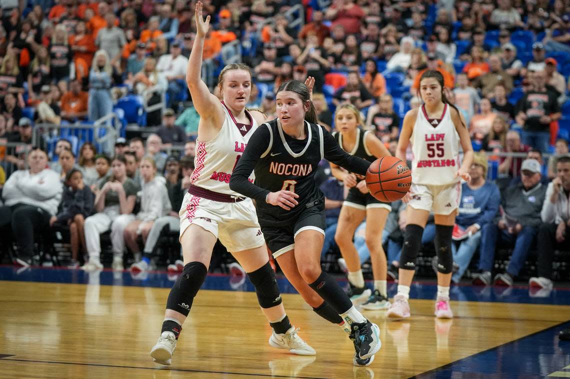 Nocona’s Megyn Meekins drives the baseline past Martin’s Mill forward Alli Vaughan in the Class 2A state championship game on Saturday, March 3, 2024 at the Alamodome in San Antonio, Texas. Martin’s Mill defeated Nocona 44-42.
