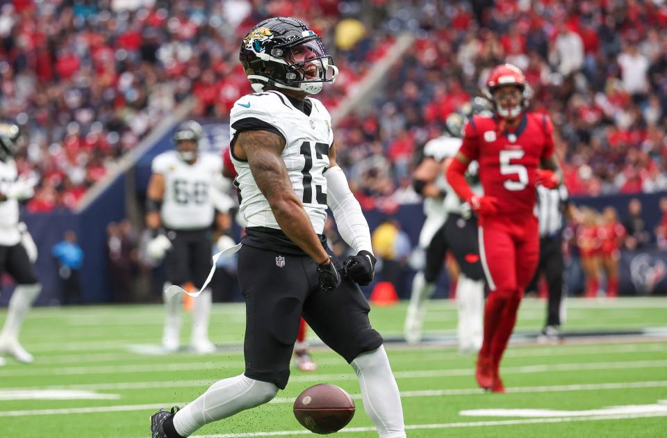 Nov 26, 2023; Houston, Texas, USA; Jacksonville Jaguars wide receiver Christian Kirk (13) reacts after making a first down during the first quarter against the Houston Texans at NRG Stadium. Mandatory Credit: Troy Taormina-USA TODAY Sports