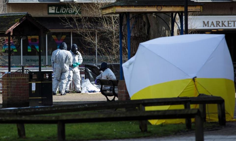 Police officers in protective suits and masks working near the site in Salisbury on Friday where Sergei Skripal and his daughter were discovered.