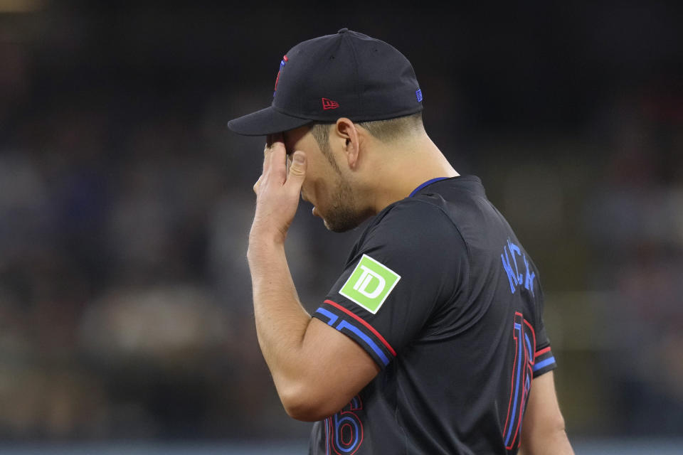 Toronto Blue Jays pitcher Yusei Kikuchi reacts during the second inning of the team's baseball game against the New York Yankees on Friday, June 28, 2024, in Toronto. (Chris Young/The Canadian Press via AP)