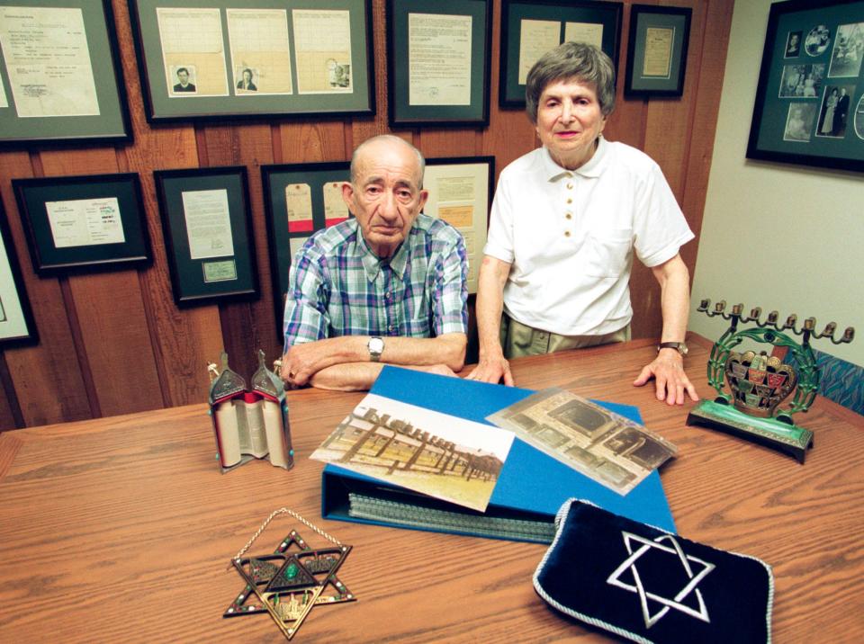 FILE - Anschel and Fela Warschau stand by artifacts from their experience in concentration camps during World War II as seen, Friday, September 7, 2001, at the Anschel and Fela Warschau room at Mead Public Library in Sheboygan, Wis.