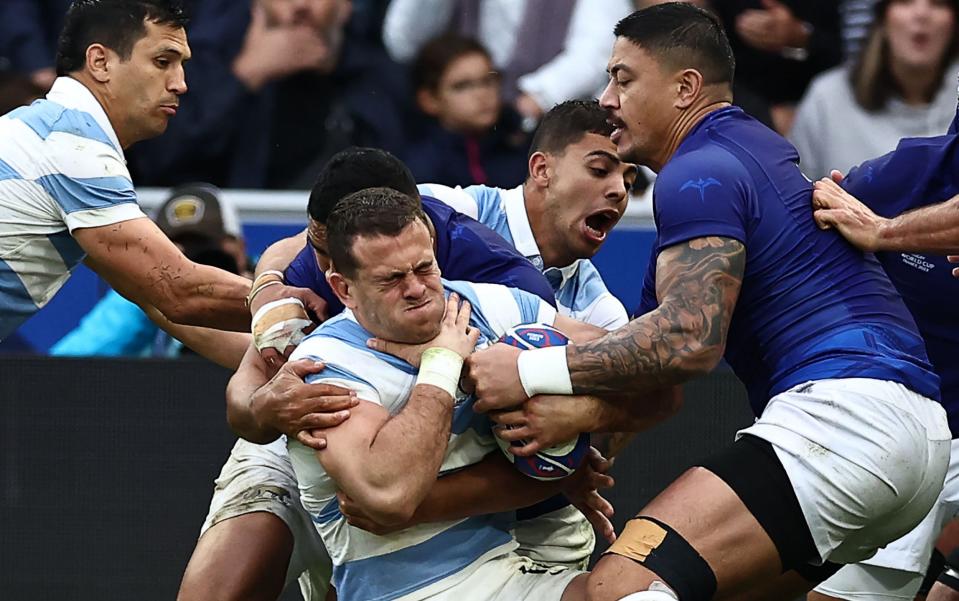 Argentina's wing Emiliano Boffelli is tackled during the France