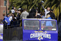 Los Angeles Rams offensive lineman Andrew Whitworth holds up the Vince Lombardi Super Bowl trophy during the team's victory parade in Los Angeles, Wednesday, Feb. 16, 2022, following their win Sunday over the Cincinnati Bengals in the NFL Super Bowl 56 football game. (AP Photo/Marcio Jose Sanchez)