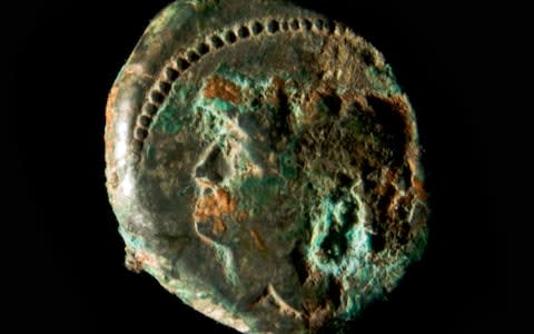 A bronze coin depicting Minerva was also found in the tomb - Credit: Superintendency of Rome