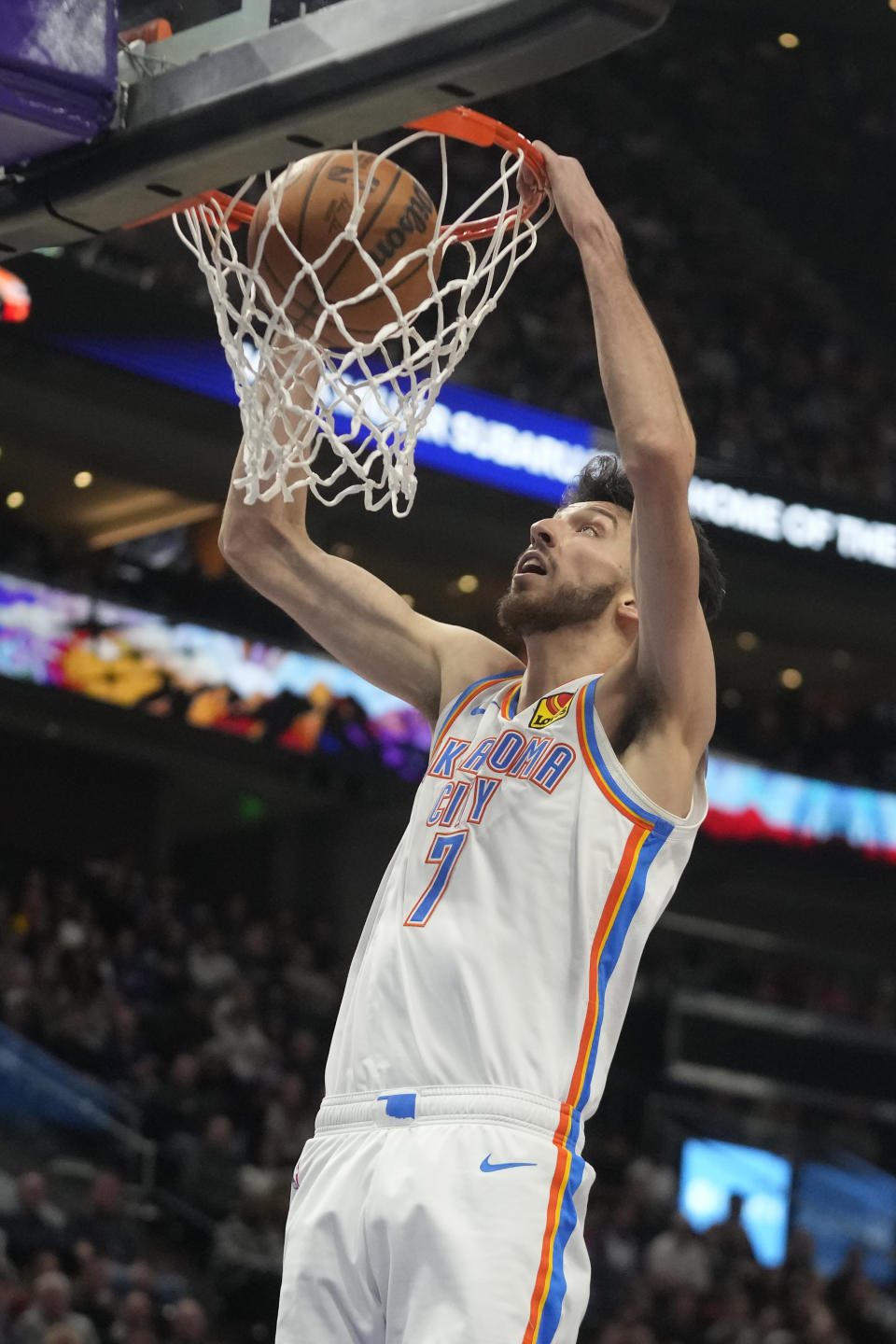 Oklahoma City Thunder forward Chet Holmgren dunks against the Utah Jazz during the first half of an NBA basketball game Thursday, Jan. 18, 2024, in Salt Lake City. (AP Photo/Rick Bowmer)