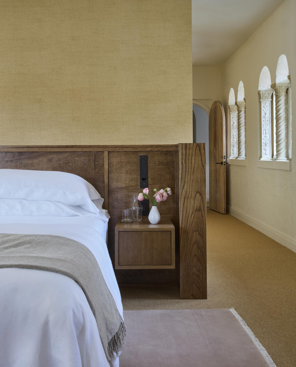 Bedroom in natural colors with wood side table