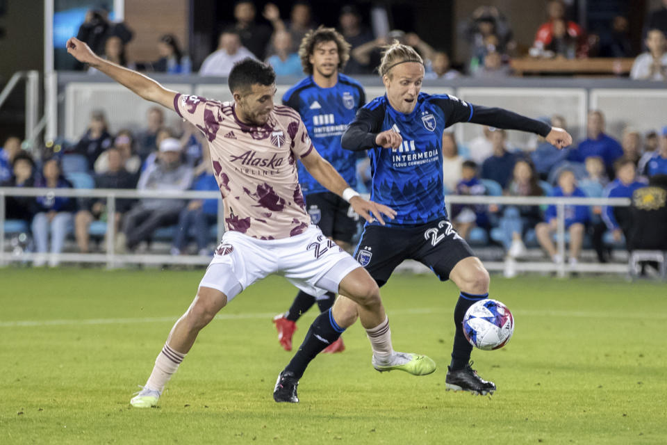 Portland Timbers midfielder Cristhian Paredes, left, defends against San Jose Earthquakes defender Tommy Thompson (22) during the second half of an MLS soccer match in San Jose, Calif., Saturday, June 17, 2023. The game ended in a scoreless draw. (AP Photo/John Hefti)