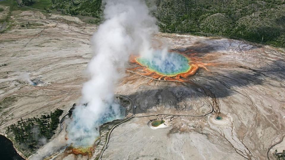 Hot springs at Yellowstone National Park give off plumes of steam.