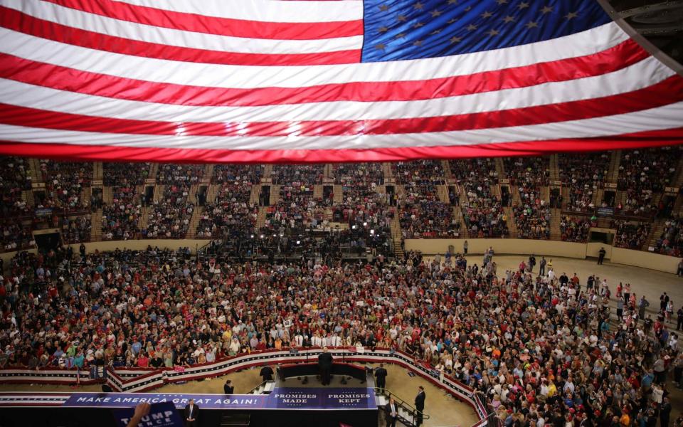 Donald Trump leads a rally marking his first 100 days in office in Harrisburg - Credit: Carlos Barria/Reuters