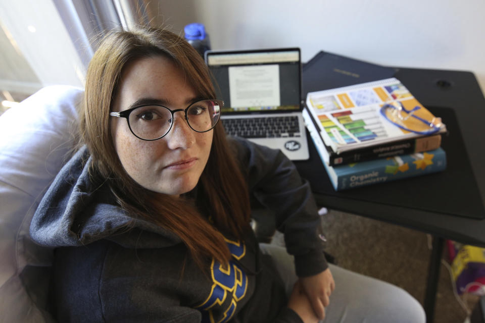 Ricki Korba, 23, sits for a portrait in her home in Bakersfield, Calif., on Friday, April 14, 2023. Korba thought she was taking the right classes at Columbia College, a community college in Sonora. She worked with a counselor and used an online catalog that shows which courses were supposed to transfer to CSU schools. But when officials at Bakersfield reviewed the transcript, they said most of her classes wouldn’t count toward her major. (AP Photo/Gary Kazanjian)