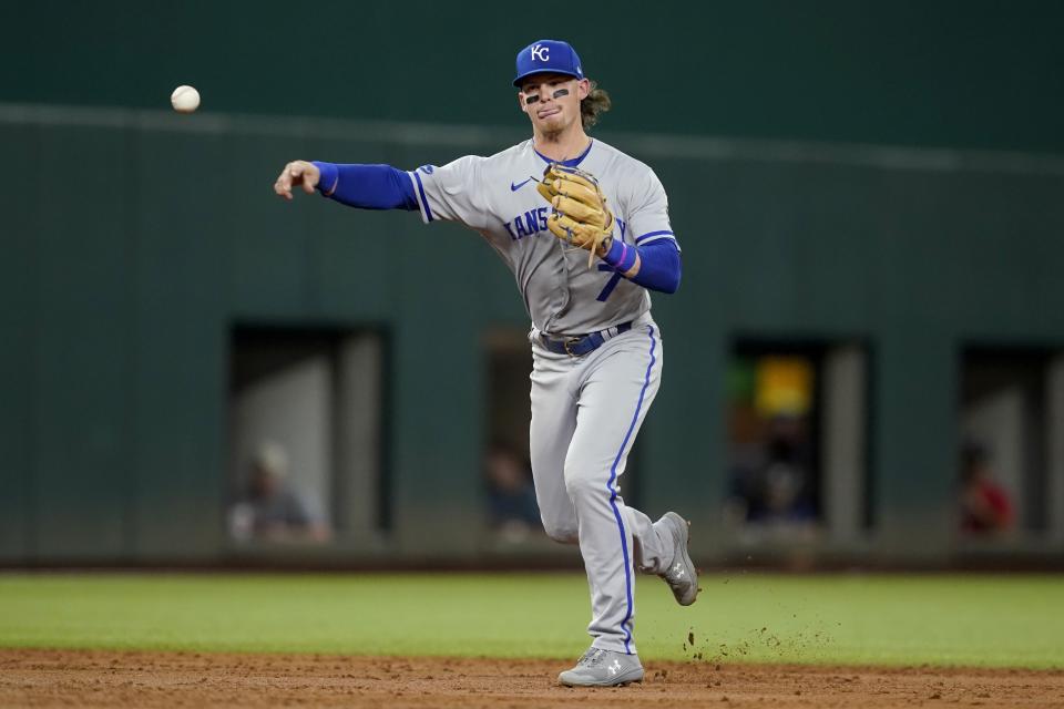 RETRANSMISSION TO CORRECT POSITION TO SHORTSTOP - Kansas City Royals shortstop Bobby Witt Jr. throws to first to complete the ground out by Texas Rangers' Adolis Garcia in the third inning of a baseball game, Tuesday, May 10, 2022, in Arlington, Texas. (AP Photo/Tony Gutierrez)