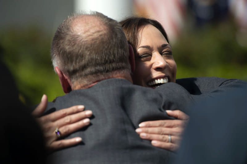 Vice President Kamala Harris hugs Mark Braden, whose son, Daniel, was a victim in the Sandy Hook Elementary School shooting, during an event on gun violence in the Rose Garden of the White House in 2022. File Photo by Bonnie Cash/UPI