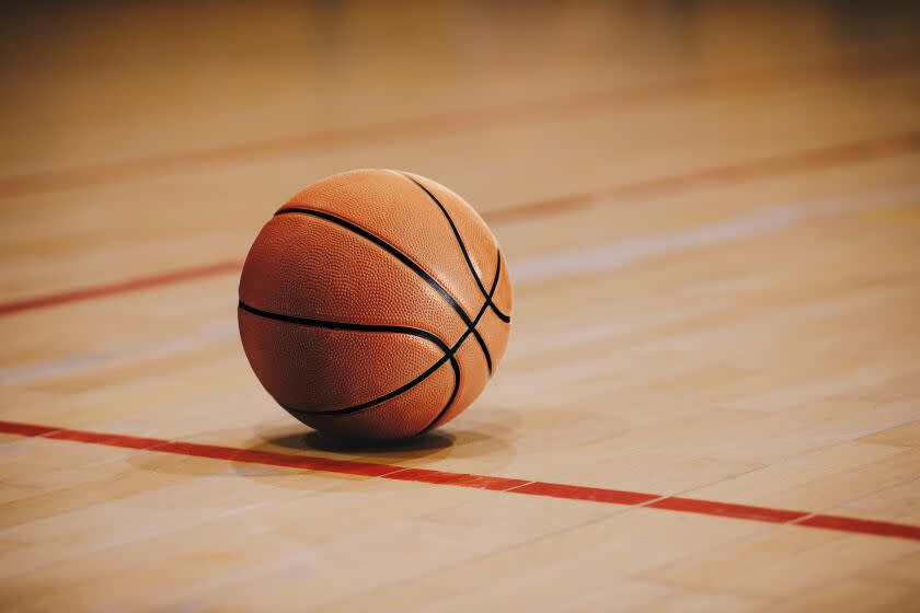Basketball on court.