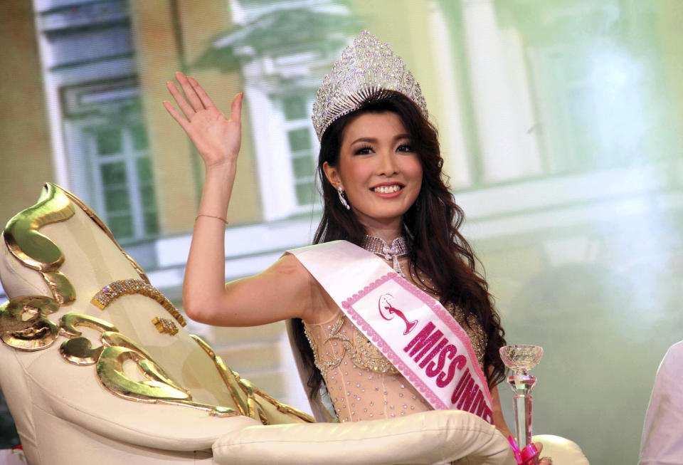 In this Thursday, Oct. 3, 2013 photo, Moe Set Wine poses for photos after she was crowned Miss Universe Myanmar at the National Theater in Yangon, Myanmar. Moe Set Wine will compete in the Miss Universe Contest in Moscow on Nov. 9. (AP Photo/Khin Maung Win)