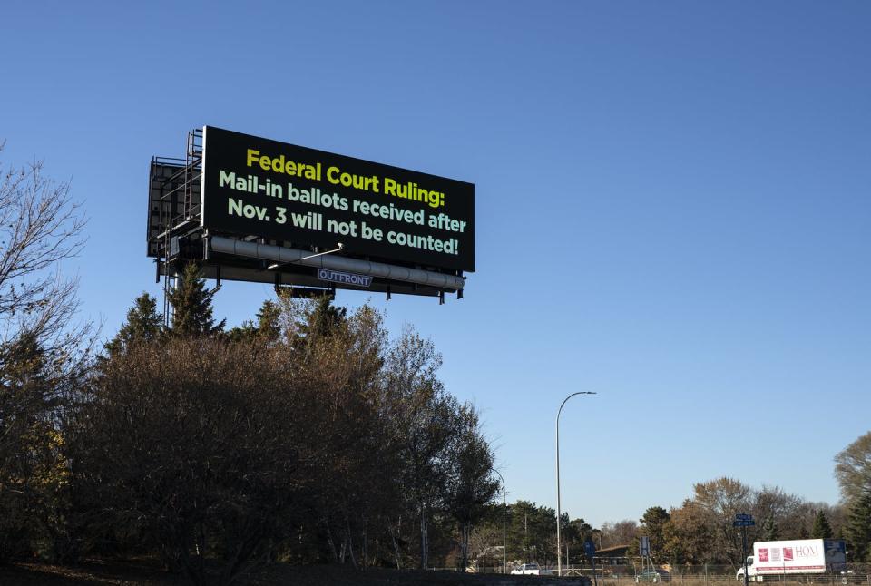 <span class="caption">One billboard outside Bloomington, Minnesota: A sign warns voters about a recent federal court ruling about absentee ballot deadlines.</span> <span class="attribution"><a class="link " href="https://www.gettyimages.com/detail/news-photo/digital-signage-near-a-highway-warns-voters-about-a-recent-news-photo/1229437857?adppopup=true" rel="nofollow noopener" target="_blank" data-ylk="slk:Stephen Maturen/Getty Images;elm:context_link;itc:0;sec:content-canvas">Stephen Maturen/Getty Images</a></span>