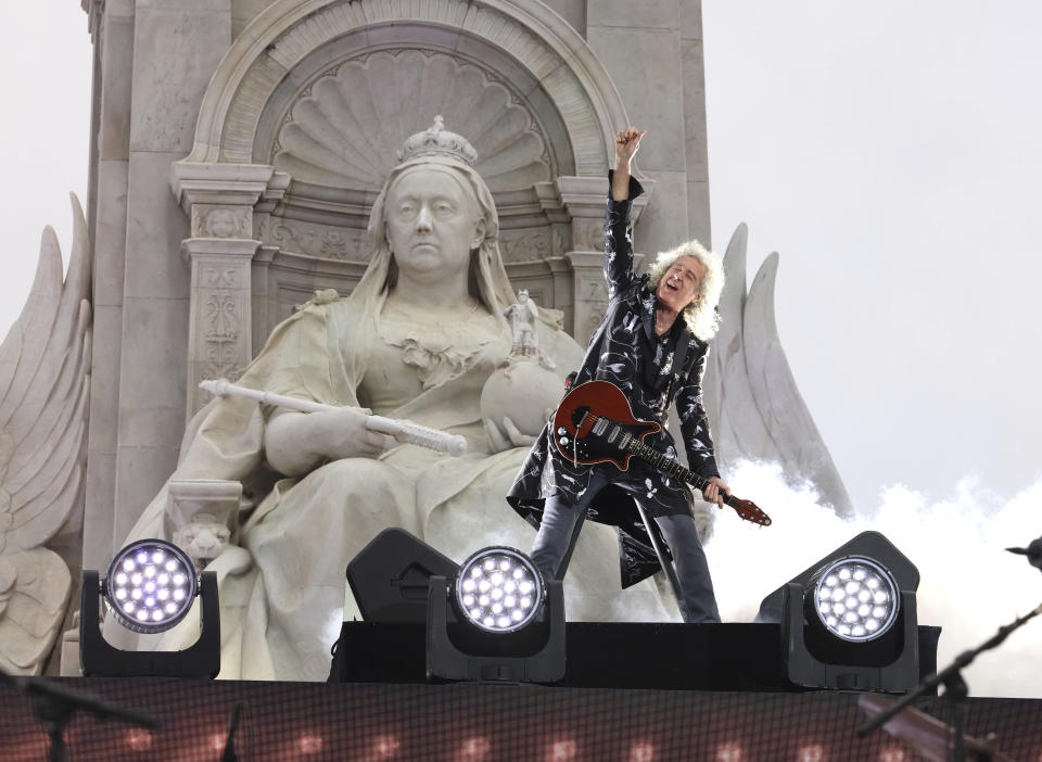 Queen guitarist Brian May performs during the Platinum Jubilee concert taking place in front of Buckingham Palace, London, Saturday June 4, 2022, on the third of four days of celebrations to mark the Platinum Jubilee. The events over a long holiday weekend in the U.K. are meant to celebrate Queen Elizabeth II's 70 years of service. (Jonathan Buckmaster/Pool Photo via AP)