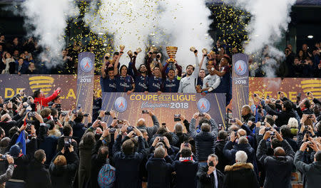 Soccer Football - Coupe de la Ligue Final - Paris St Germain vs AS Monaco - Matmut Atlantique Stadium, Bordeaux, France - March 31, 2018 Paris Saint-Germain's Thiago Silva lifts the trophy as his team celebrates after victory REUTERS/Regis Duvignau