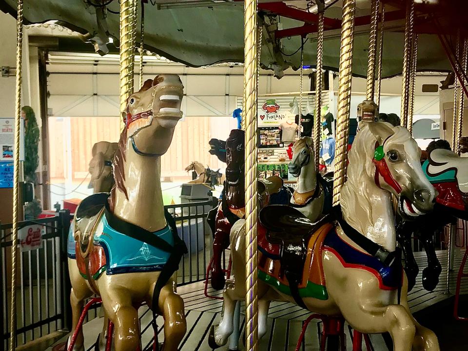 The horses on the Merry-Go-Round at Funland in Rehoboth Beach, around since 1962, get all the attention. But Champion, the coin-operated kiddie ride seen in the background, is just as old, if not older. 8/1/2023