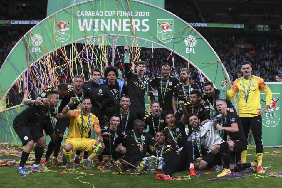 Manchester City players celebrate winning the League Cup soccer match final with a 2-1 score against Aston Villa, at Wembley stadium, in London, England, Sunday, March 1, 2020. (AP Photo/Ian Walton)