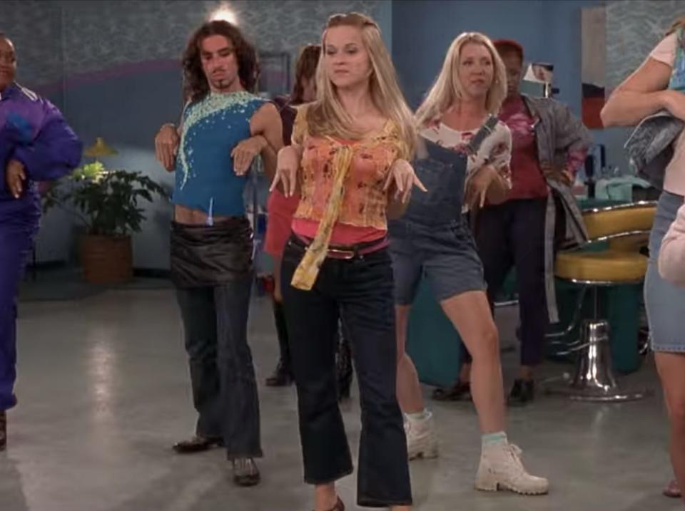 Reese Witherspoon demonstrating the bend and snap move at a nail salon in "Legally Blonde."