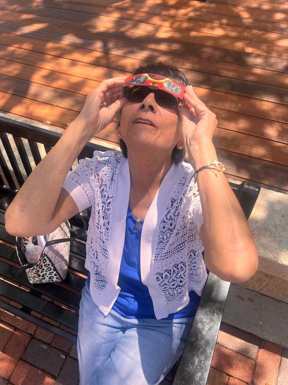 "Wow. I have never seen this before." Anita Mazella, of Melbourne as she looks up at the eclipse.