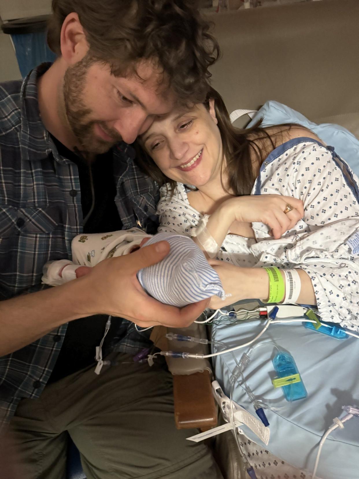 Newlyweds and new parents Michael and Nora cradle their newborn baby Reggie, born at 33 weeks at Northern Westchester Hospital in Mount Kisco, NY. Reggie was born hours after his parents were married in the Labor & Delivery unit.