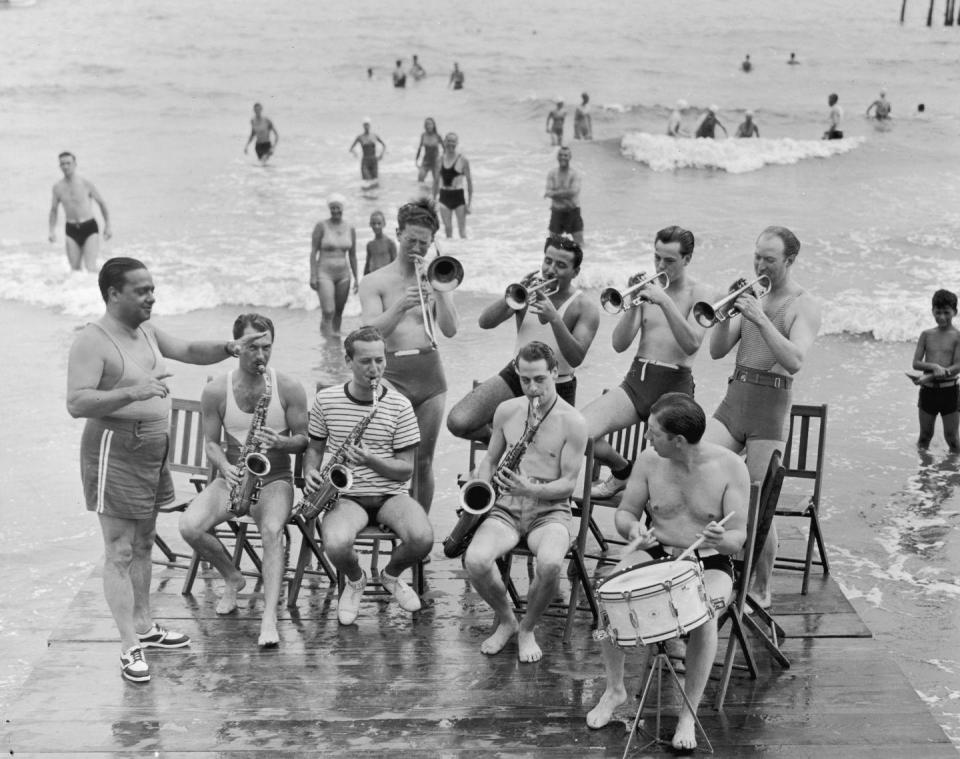 <p>A jazz ensemble in the ocean? With instruments in hand, members of Vincent Lopez’s jazz band were seen putting on a show for beach-goers.</p>