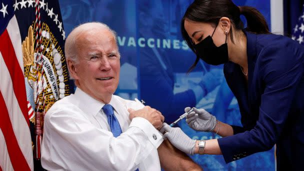 PHOTO: President Joe Biden receives an updated coronavirus disease (COVID-19) vaccine while launching a new plan for Americans to receive booster shots and vaccinations, onstage in an auditorium on the White House campus in Washington, October 25, 2022. (Jonathan Ernst/Reuters)