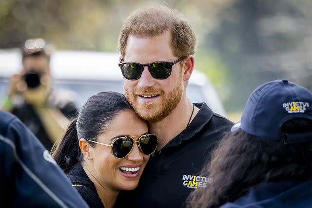 <p>Remko de Waal / ANP / AFP/ Getty</p> Meghan Markle and Prince Harry at the Invictus Games The Hague on April 16, 2022