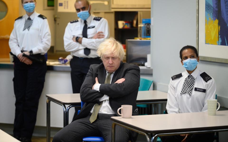 Boris Johnson during a visit to a police station in Uxbridge, his constituency, on December 17 - Leon Neal 