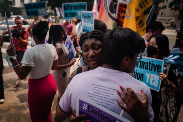 Two Harvard University students hug outside of the U.S. Supreme Court on Thursday in Washington.