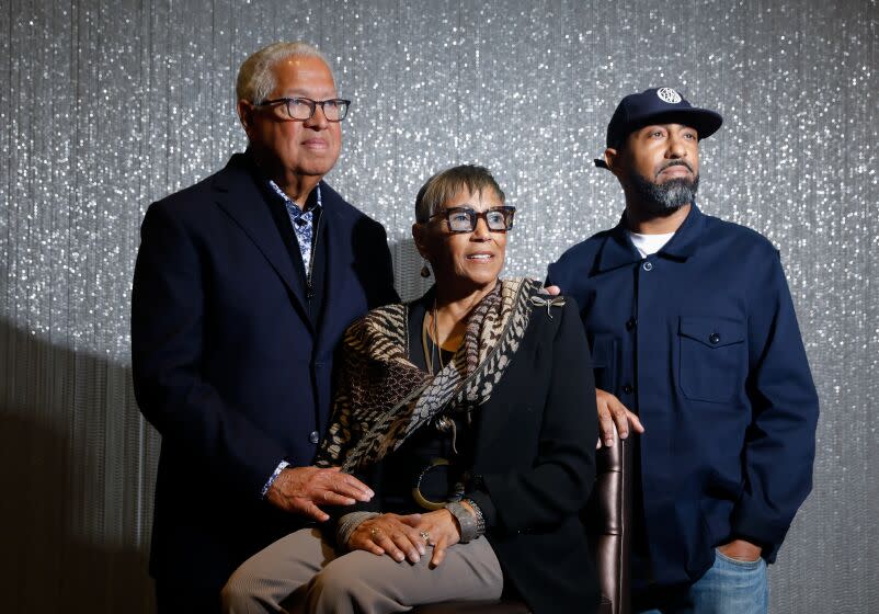 INGLEWOOD-CA-FEBRUARY 15, 2023: Bernard and Shirley Kinsey, left, with their son Khalil, are photographed at SoFi Stadium in Inglewood on February 15, 2023, where the Kinsey Collection is on display. (Christina House / Los Angeles Times)