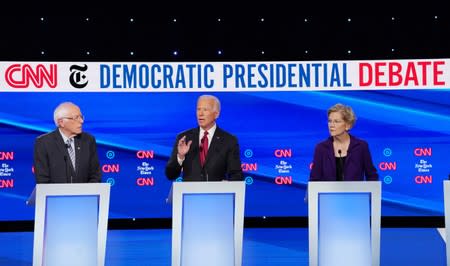 Democratic presidential candidate former Vice President Biden speaks as Senators Warren and Sanders listen during the fourth U.S. Democratic presidential candidates 2020 election debate at Otterbein University in Westerville, Ohio U.S.