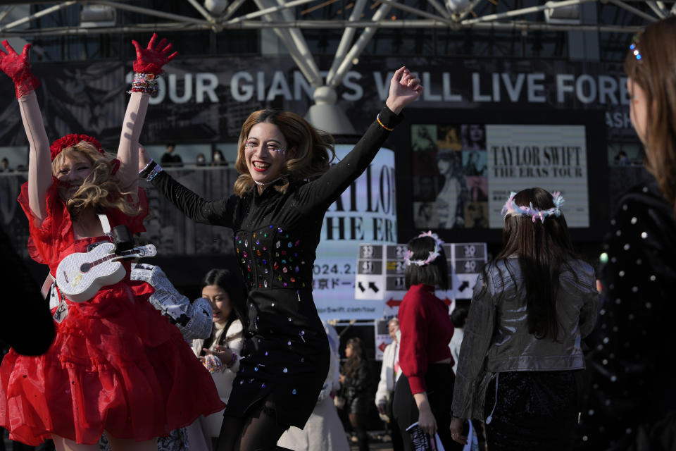 Women pose for a photo before Taylor Swift's concert at Tokyo Dome in Tokyo, Saturday, Feb. 10, 2024. (AP Photo/Hiro Komae)